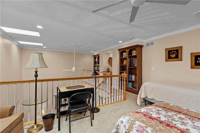 bedroom featuring light colored carpet, a skylight, and ornamental molding