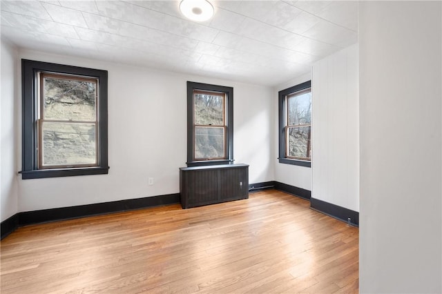 unfurnished room featuring light wood-type flooring