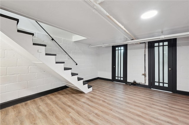 basement featuring wood-type flooring