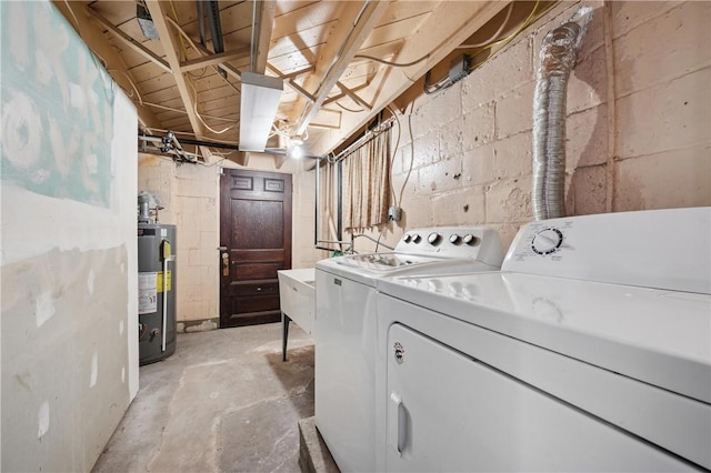 washroom featuring washer and dryer and gas water heater