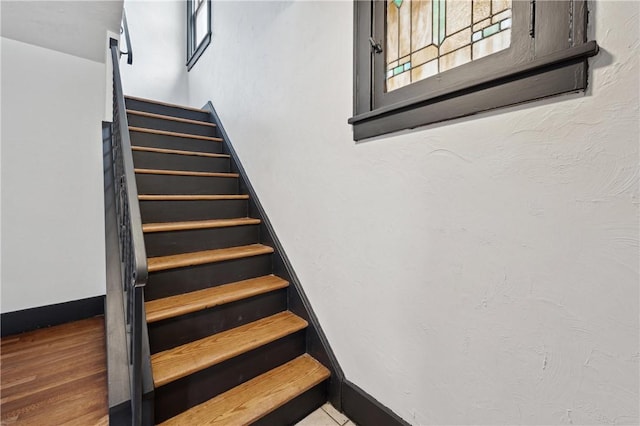 stairway featuring hardwood / wood-style floors