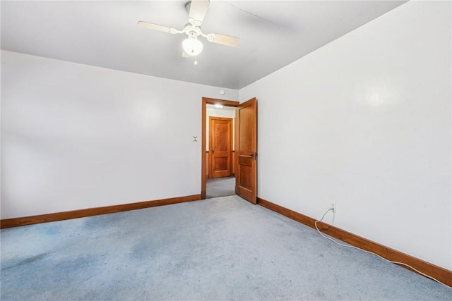 carpeted empty room with ceiling fan