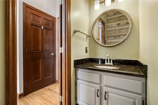 bathroom featuring wood-type flooring and vanity