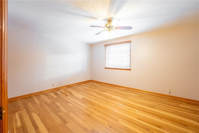 spare room with ceiling fan and light hardwood / wood-style floors