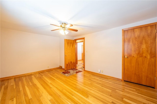 unfurnished room with ceiling fan and light hardwood / wood-style floors