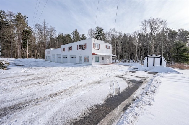 view of front of property featuring a storage unit