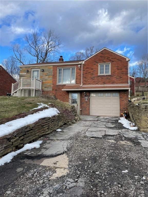 view of front of property with a garage