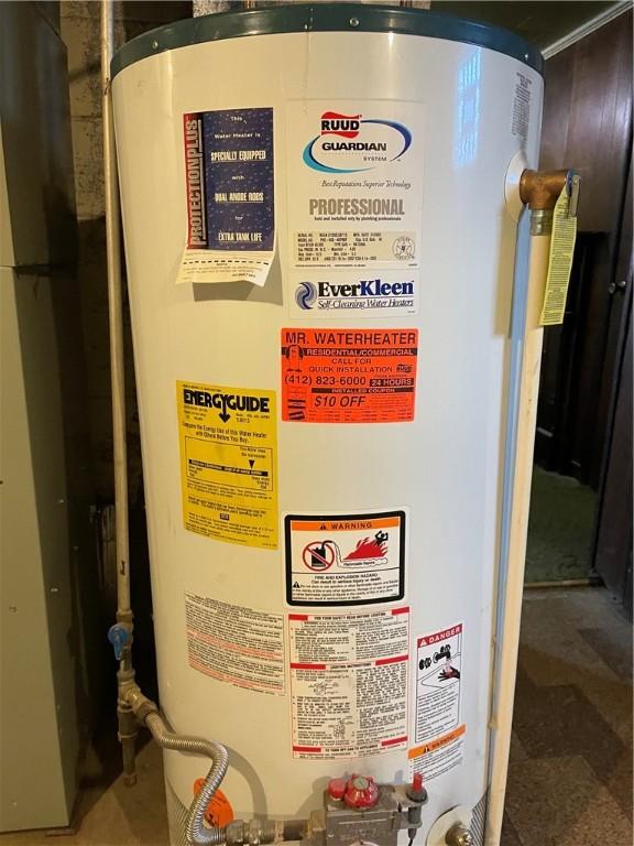 utility room featuring gas water heater