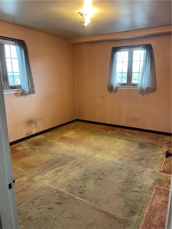 empty room with carpet flooring