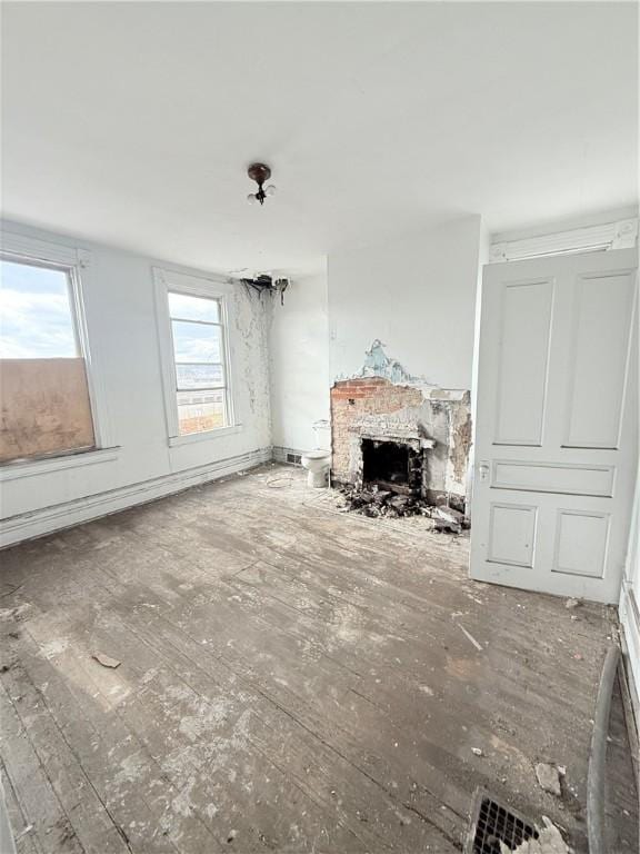 unfurnished living room featuring hardwood / wood-style floors