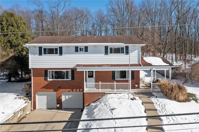 view of property featuring a porch and a garage