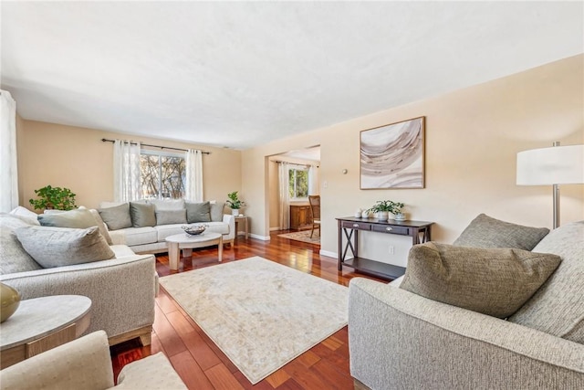 living room with dark hardwood / wood-style floors