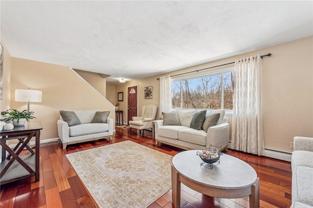 living room with wood-type flooring and a baseboard radiator