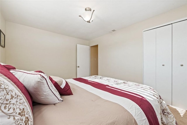 carpeted bedroom featuring a closet