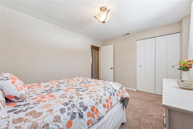 carpeted bedroom with a closet