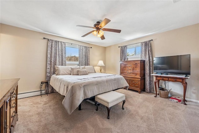 carpeted bedroom with multiple windows, ceiling fan, and baseboard heating