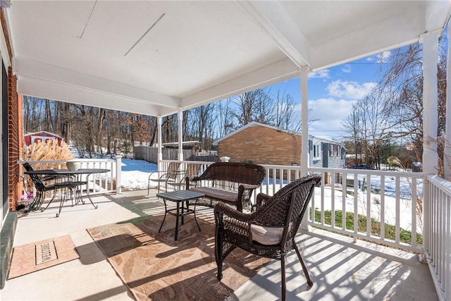 view of snow covered patio