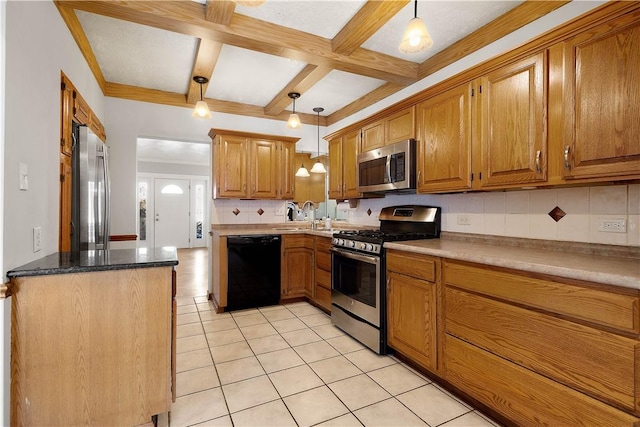 kitchen with hanging light fixtures, decorative backsplash, beamed ceiling, and appliances with stainless steel finishes