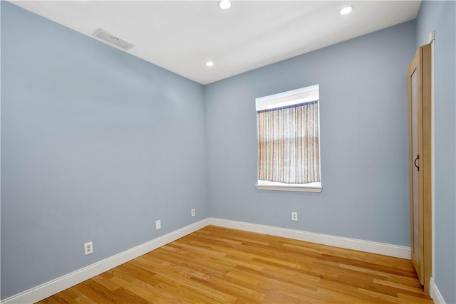 unfurnished room featuring light hardwood / wood-style flooring