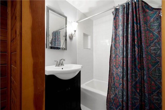 bathroom featuring vanity and shower / bath combo with shower curtain