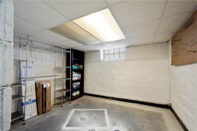 basement featuring a drop ceiling