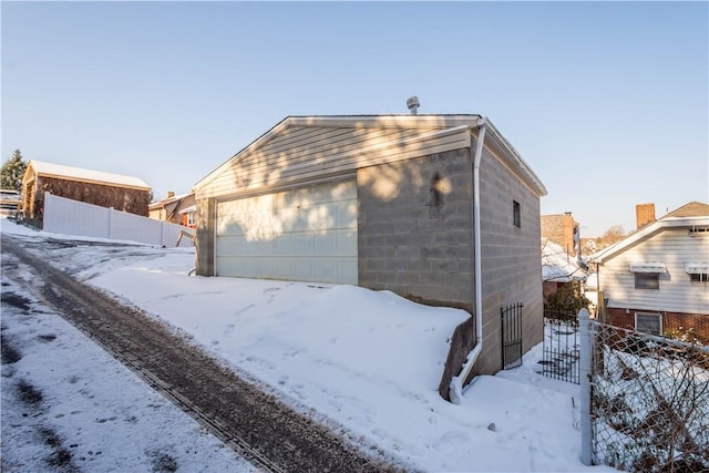 view of snow covered garage