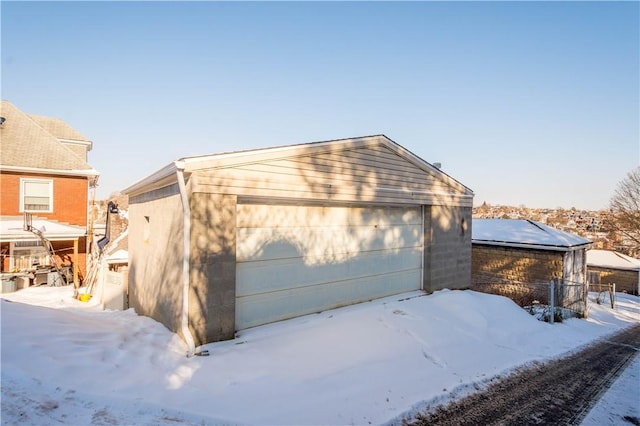 view of snow covered garage