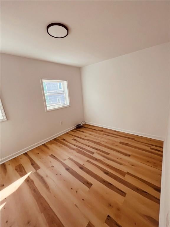 spare room featuring light wood-type flooring