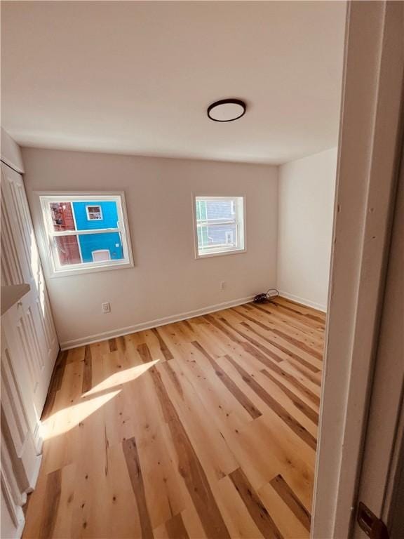 unfurnished room with light hardwood / wood-style flooring