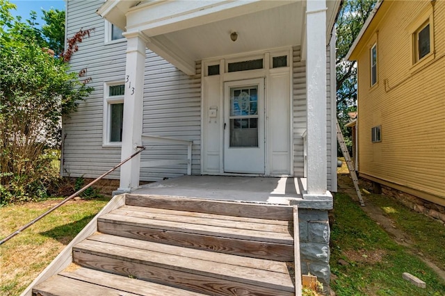 doorway to property featuring covered porch