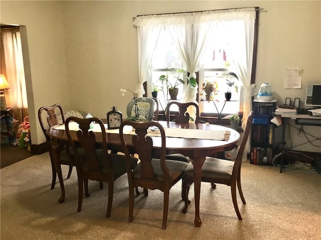 view of carpeted dining space