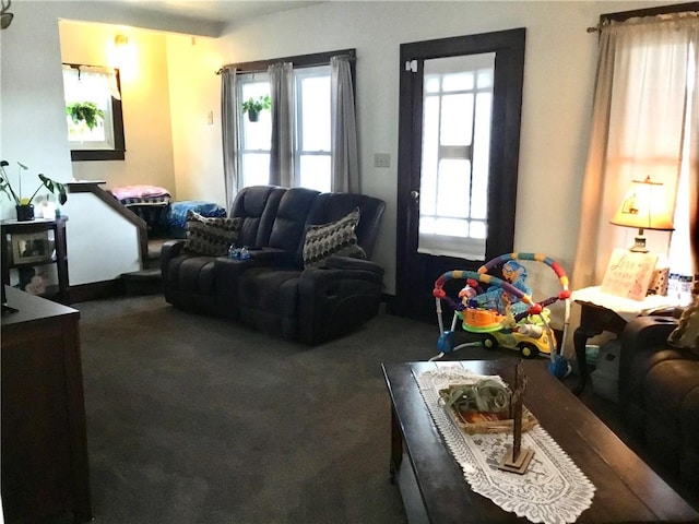 carpeted living room featuring plenty of natural light