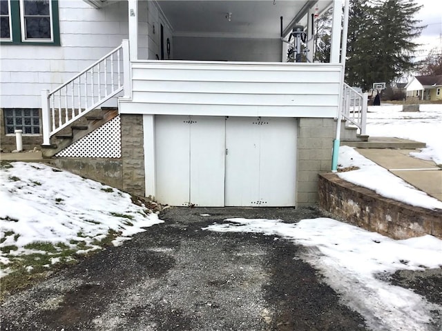 view of snow covered garage