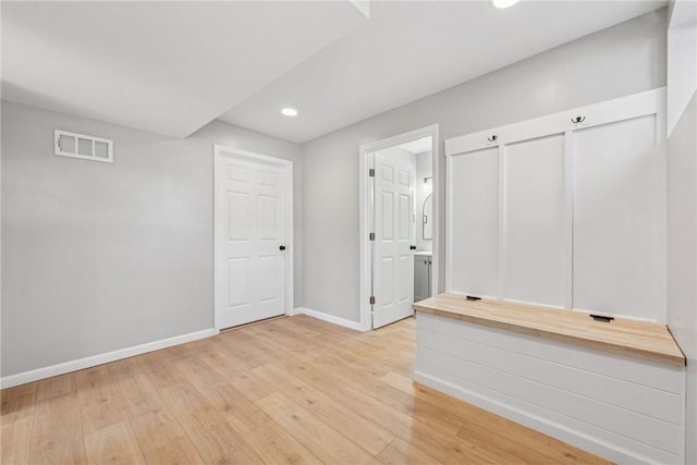 empty room with light hardwood / wood-style floors