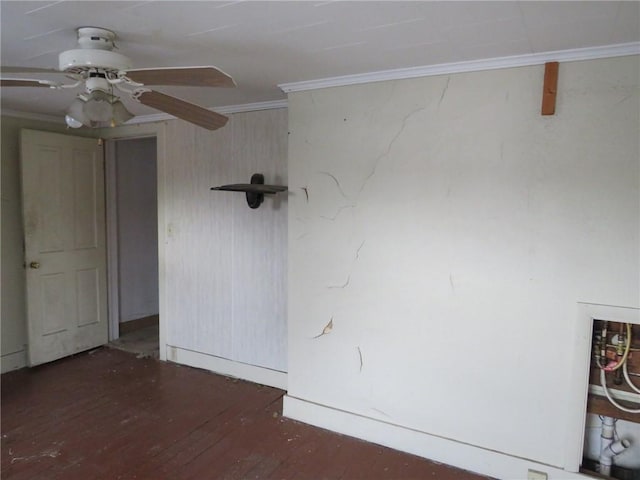 interior space featuring a ceiling fan, wood-type flooring, and ornamental molding