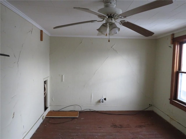 empty room with crown molding, ceiling fan, and dark wood-type flooring