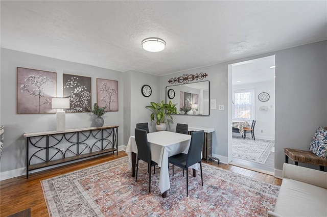 dining room with hardwood / wood-style flooring