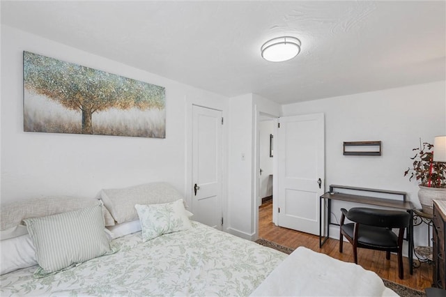 bedroom featuring wood-type flooring