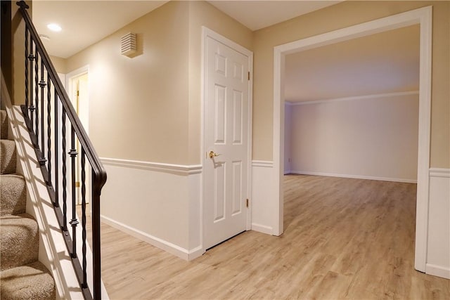 stairs featuring wood-type flooring