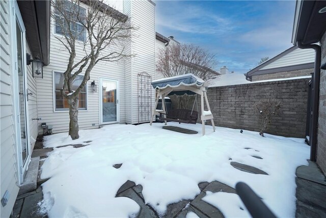 view of yard layered in snow