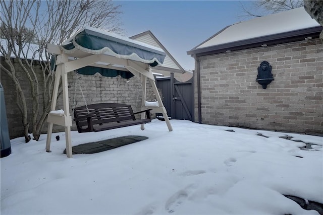 view of yard layered in snow