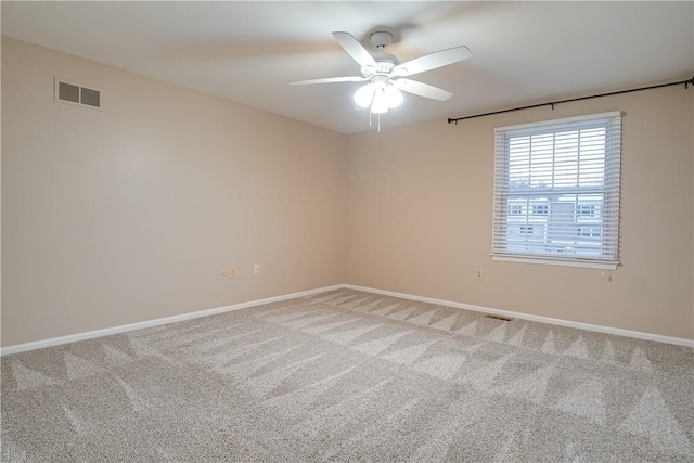 carpeted empty room featuring ceiling fan