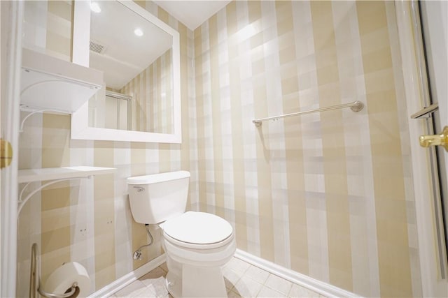 bathroom with tile patterned flooring and toilet