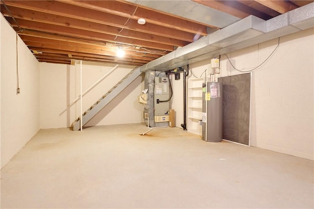 basement featuring heating unit and water heater