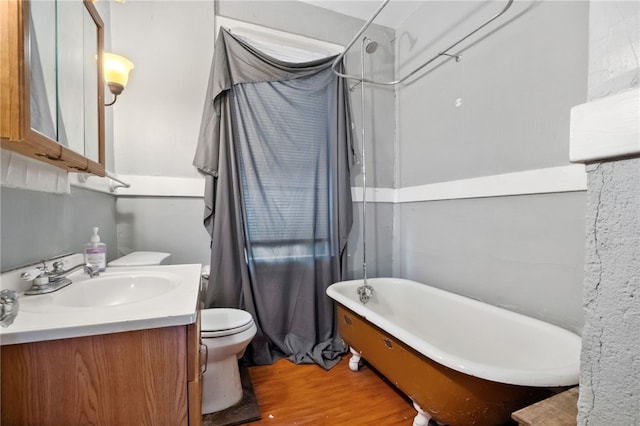 full bathroom with hardwood / wood-style flooring, vanity, toilet, and tub / shower combination