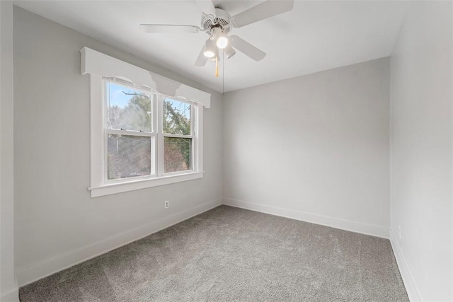 unfurnished room featuring ceiling fan and carpet