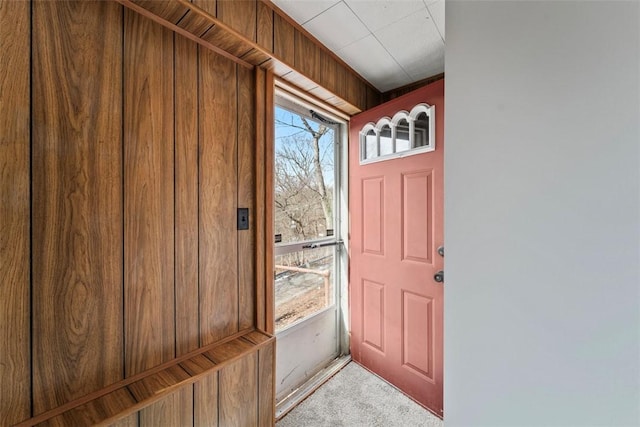 doorway with light carpet