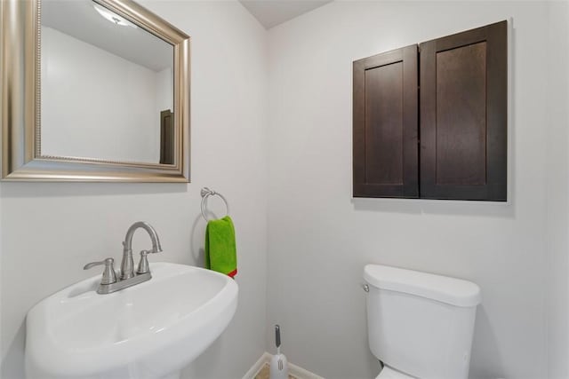 bathroom with toilet and sink