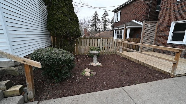 view of yard with a wooden deck