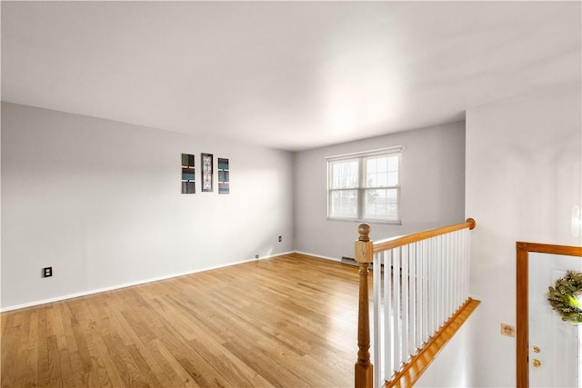 unfurnished room with light hardwood / wood-style flooring